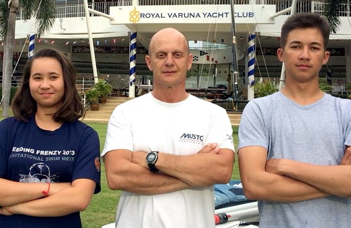 Janisara Sasha Romanyk (left) and Mikhail Arthit Romanyk (right) pose with their sailing coach Dimitrios Theorakis at Royal Varuna Yacht Club in Pattaya.