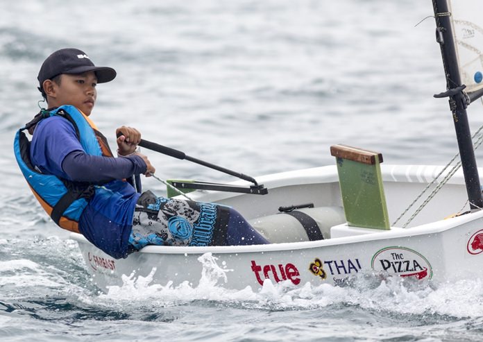 A young Optimist sailor hones his skills during the Phuket regatta.
