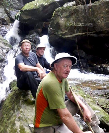 The scribe and climbing pals pause next to a waterfall during their ascent of Soi Dao mountain.