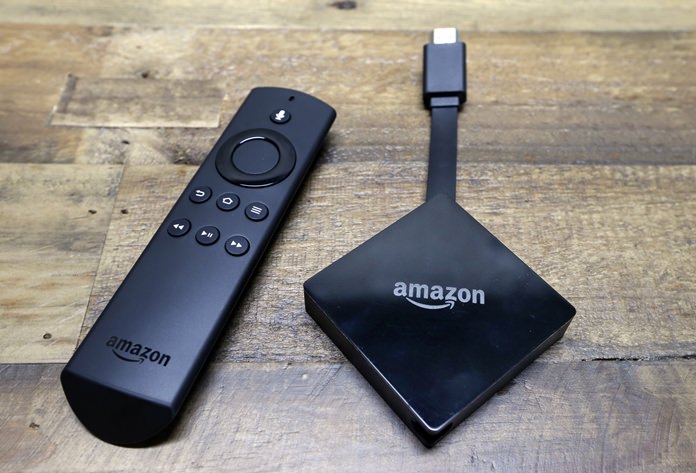 This file photo shows an Amazon Fire TV streaming device with its remote control. On Tuesday, Dec. 5, 2017, Google announced plans to pull its popular YouTube video service from Amazon’s Fire TV and Echo Show devices in an escalating feud that has caught consumers in the crossfire. (AP Photo/Elaine Thompson, File)