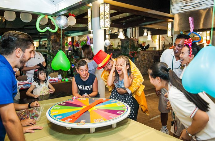 “I won” screams this lovely girl. Other guests happily share her exuberance.