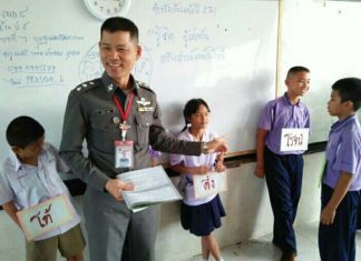 Pol. Capt. Prasom Boonman teaches the Drug Abuse Resistance Education program in Pattaya schools.