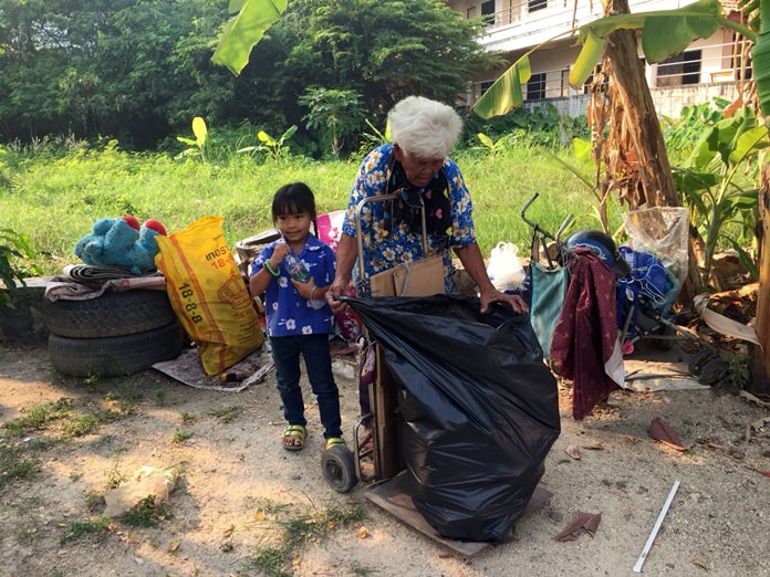 80-year-old La-lad Manmai gets up each day at 3 a.m. to scavenge around her home for recyclables to take care of her 5-year-old great granddaughter.