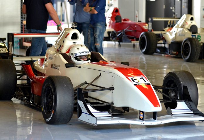The young Pattaya racer waits in the garage at the Yas Marina circuit in Abu Dhabi.