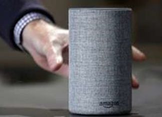 In this Wednesday, Sept. 27, 2017, file photo, a new Amazon Echo is displayed during a program announcing several new Amazon products by the company, in Seattle. (AP Photo/Elaine Thompson, File)