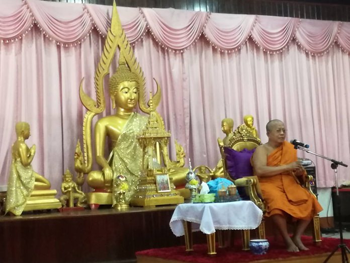 Region 13 Ecclesiastical Gov. Phomkavee closes the fundraising drive at Chaimongkol Temple after the temple raised over 800,000 baht with their latest “tod pha pa” robes-giving ceremony.