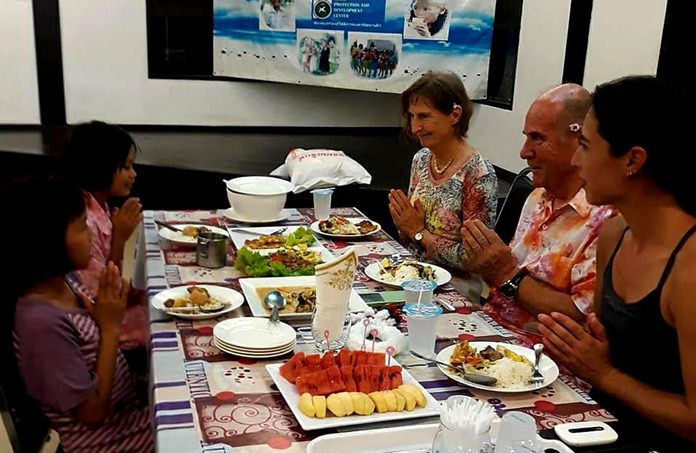 The children enjoy a free lunch provided by their benevolent guests.