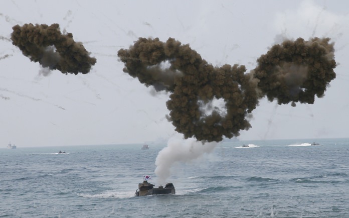 South Korea Amphibious assault vehicles fire smoke screens during the Cobra Gold U.S.-Thai joint military exercise on Hat Yao beach, Saturday, Feb. 17, 2018. Approximately 11,000 military personnel from the U.S., Thailand, and South Korea are taking part in the annual drill. (AP Photo/Sakchai Lalit)