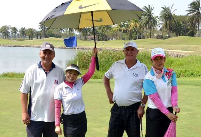 Players take shade from the sweltering sun.