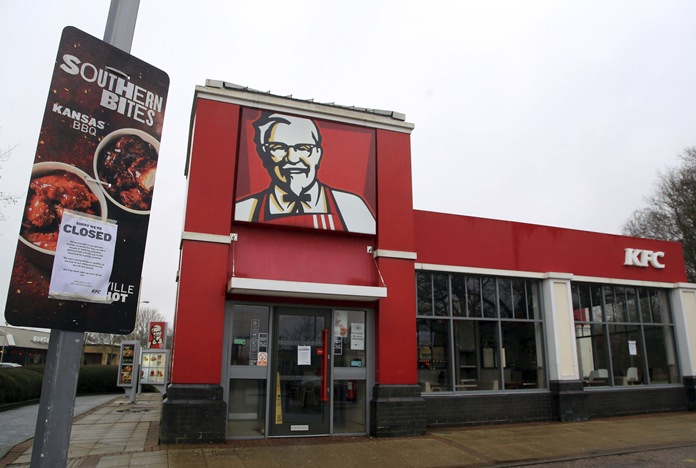 A closed sign is seen outside a KFC restaurant near Ashford, England, Monday, Feb. 19, 2018. Fast-food chain KFC was forced to close most of its 900 outlets in Britain and Ireland because of a shortage of chicken. (Gareth Fuller/PA via AP)