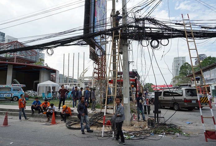 PEA workers removed and replaced the tilted pole in front of the Tree Town Market, but apparently not the massive tangle of wires that caused the problem in the first place.