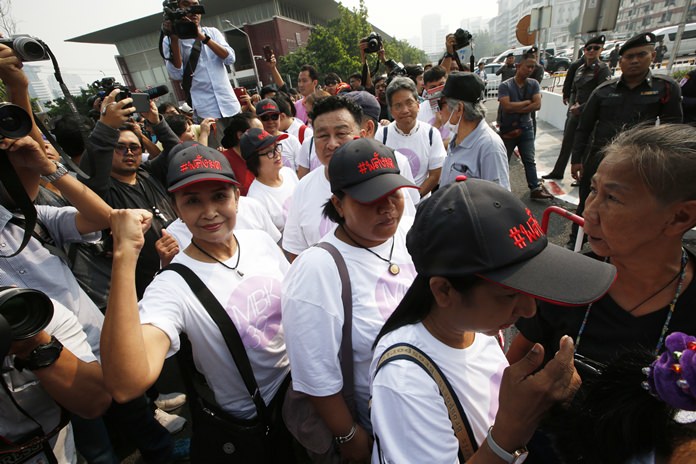 Democracy activists gather in front of a police station in Bangkok, Thursday, Feb. 8. (AP Photo/Sakchai Lalit)