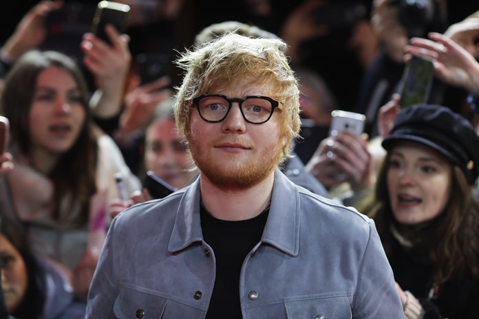 Singer-songwriter Ed Sheeran is shown arriving at the 68th edition of the International Film Festival Berlin, Berlinale, in Berlin, Germany, Friday, Feb. 23. (AP Photo/Markus Schreiber)