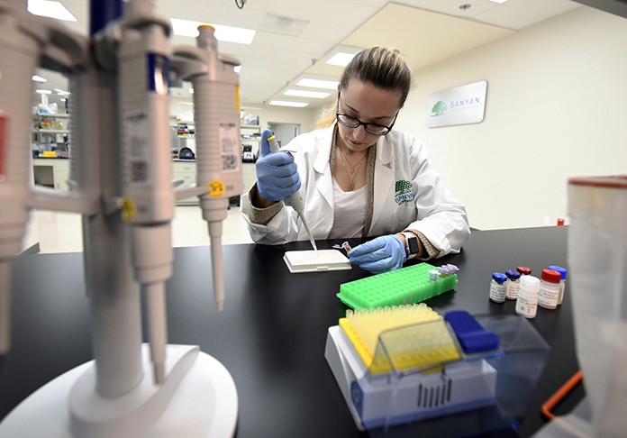 Product development scientist Veronika Shevchenko works with patient samples at Banyan Biomarkers Tuesday, Feb. 13, 2018, in San Diego. The company is developing a blood test to help doctors diagnose traumatic brain injuries. (AP Photo/Denis Poroy)