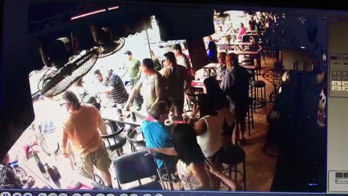 Videos of the incident at the Red Cat Bar went viral on the internet, prompting calls for a crackdown on fake-goods sellers.