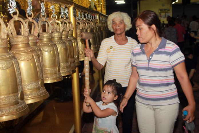 Another ritual is to ring the temple bells to cleanse the souls and drive away bad luck. 