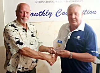 Brian Chapman (right) presents the medal to Tom Parker.