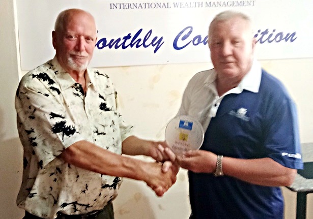 Brian Chapman (right) presents the medal to Tom Parker.