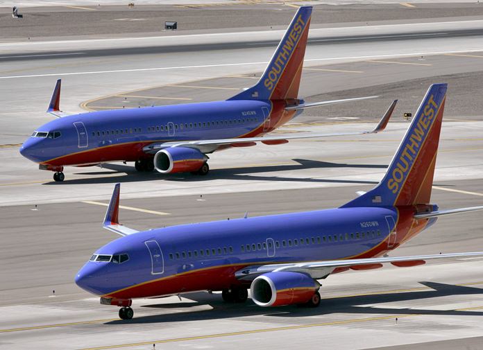 Southwest Airlines says a child was hurt by a support dog in Phoenix on Wednesday, Feb. 21, 2018, as passengers boarded a plane in Phoenix. (AP Photo/Matt York, file)