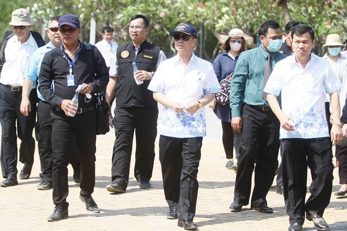 Gov. Pakarathorn Thienchai (center) visited Koh Larn to see for himself the 40,000 tons of rubbish that has accumulated due to Pattaya’s inability to haul away the waste.