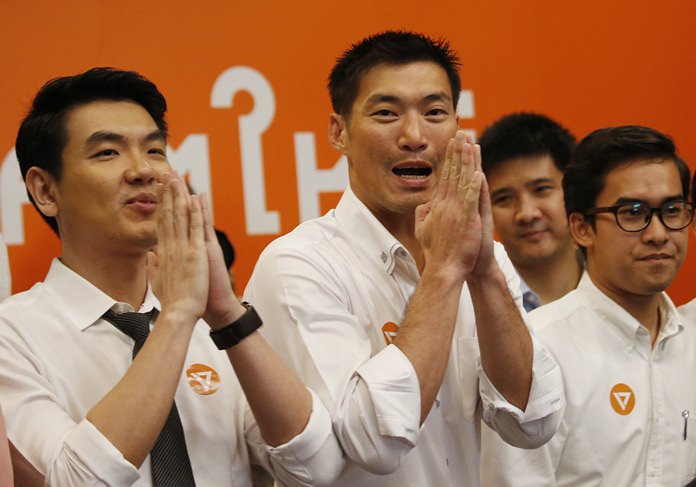 Thai billionaire Thananthorn Juangroongruangkit, center, gives a traditional Thai greeting after announcing the launch of his new Future Forward Party in Bangkok, Thursday, March 15. (AP Photo/Sakchai Lalit)