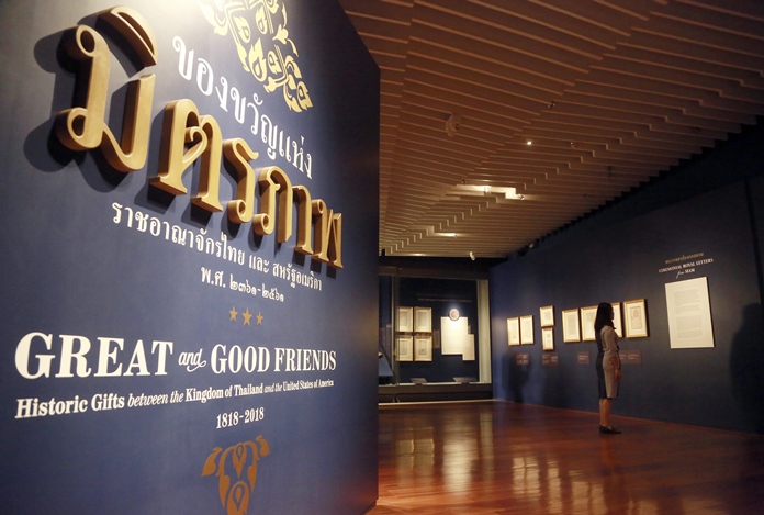 In this March 22, 2018, photo, a visitor tours the exhibition titles "Great and Good Friends," inside the Grand Palace in Bangkok. (AP Photo/Sakchai Lalit)