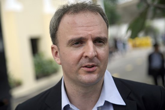 British labor rights activist Andy Hall in shown outside the Supreme Court in Bangkok in this Nov. 3, 2016, file photo. (AP Photo/Sakchai Lalit)