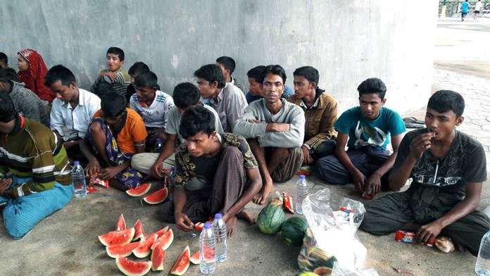 People who claim to be Rohingya refugees eat food in Krabi province, Thailand, Sunday, April 1. (AP Photo)