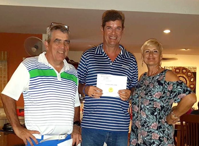 A flight winner Dani Grob (centre) receives his prize from Chrusi and Monika.