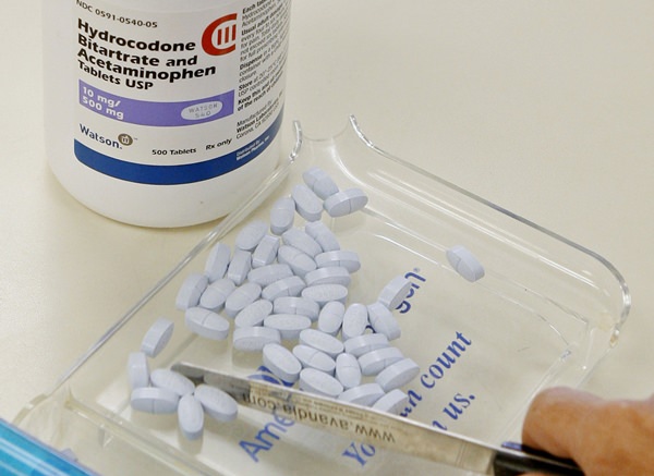 Opioids including Vicodin and fentanyl patches worked no better than Tylenol and other over-the-counter pills at relieving chronic back pain and hip and knee arthritis in a year-long study of mostly men at Minneapolis VA clinics. Both groups had slight improvement. (AP Photo/Sue Ogrocki, File)