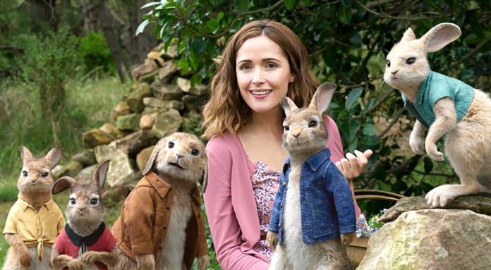 This image shows Rose Byrne with characters (from left) Mopsy, voiced by Elizabeth Debicki, Flopsy, voiced by Margot Robbie, Benjamin Bunny, voiced by Colin Moody, Peter Rabbit, voiced by James Corden and Cottontail, voiced by Daisy Ridley in a scene from “Peter Rabbit.” (Columbia Pictures/Sony via AP)