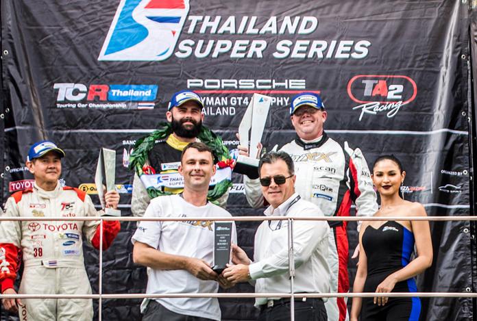 Thomas Raldorf (standing rear-right) and Shaun Varney (rear-left) celebrate on the podium after winning Race 1 of the Thailand Super Series at the Sepang Circuit in Sepang Malaysia, Saturday, March 31.