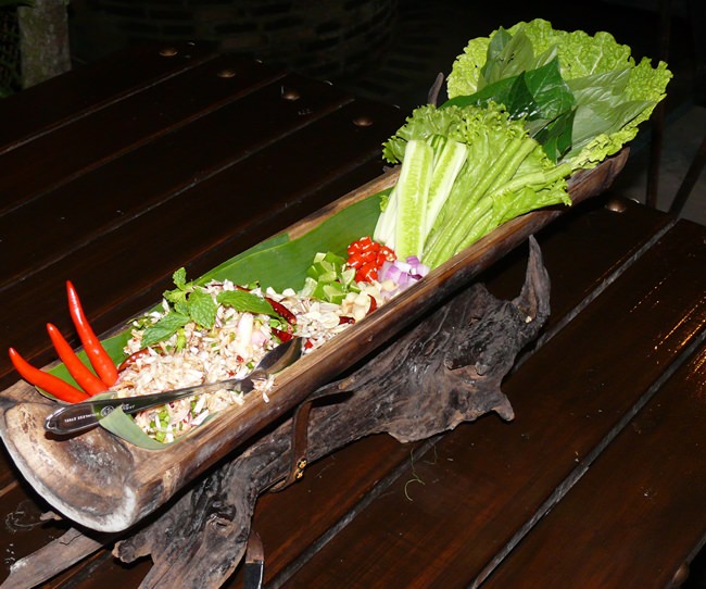 Fish larb presented in bamboo.