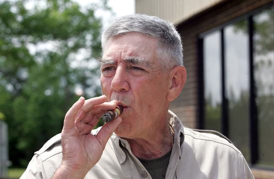 In this May 15, 2006, file photo, actor and retired Marine Gunnery Sgt. R. Lee Ermey takes a break for a smoke outside New River Air Station’s Staff NCO club in Jacksonville, N.C. (Randy Davey/The Jacksonville Daily News via AP)