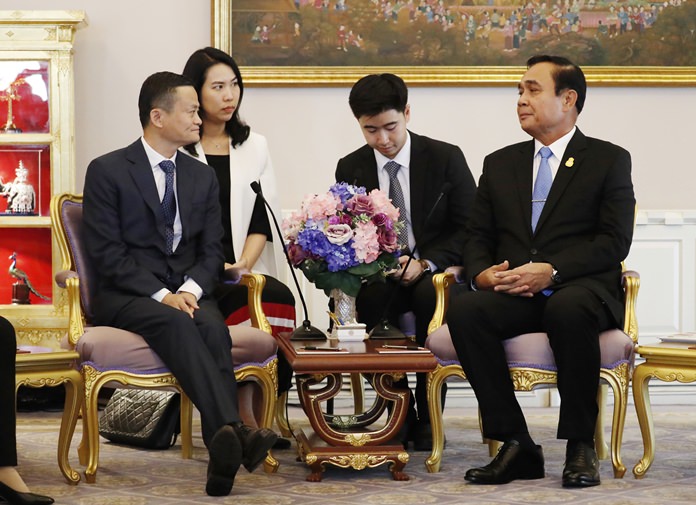 Jack Ma, left, founder of Chinese e-commerce giant Alibaba, meets Prime Minister Prayuth Chan-ocha in Bangkok Thursday, April 19, during a visit to the country to announce the group’s investment in the Thai government’s Eastern Economic Corridor (EEC) scheme. (Jorge Silva/Pool Photo via AP)