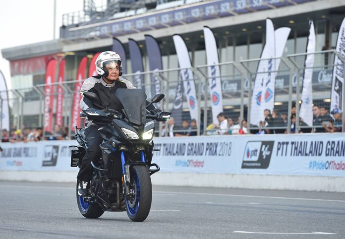 Prime Minister Prayut Chan-o-cha rides a motorcycle at the Chang International Circuit in Buriram, Monday, May 7.