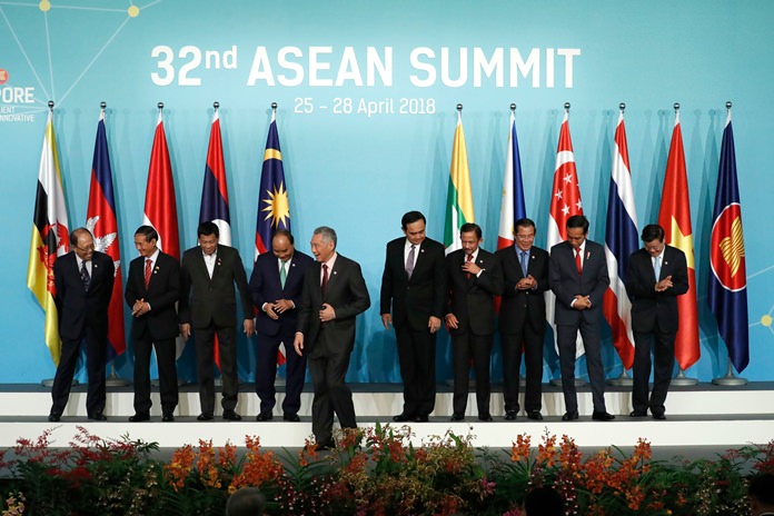 Leaders and country representatives from left to right; Malaysia’s Former Deputy Prime Minister Tun Musa Hitam, Myanmar President Win Myint, Philippine President Rodrigo Duterte, Vietnam’s Prime Minister Nguyen Xuan Phuc, Singapore’s Prime Minister Lee Hsien Loong, Thailand’s Prime Minister Prayuth Chan-ocha, Brunei’s Sultan Hassanal Bolkiah, Cambodia’s Prime Minister Hun Sen, Indonesia’s President Joko Widodo, and Laos Prime Minister Thongloun Sisoulith, leave the stage after their group photo during the opening ceremony of the 32nd ASEAN Summit on Saturday, April 28, 2018, in Singapore. (AP Photo/Yong Teck Lim)