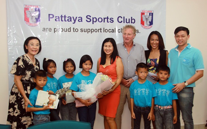 HHNFT Director Radchada Chomjinda (left) graciously accepts a donation from Pattaya Sports Club President Maurice Roberts and Social Welfare Chairwoman Noi Emerson.