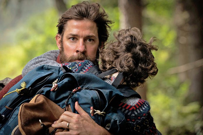 This image shows actor-director John Krasinski im a scene from “A Quiet Place,” with Noah Jupe. (Jonny Cournoyer/Paramount Pictures via AP)