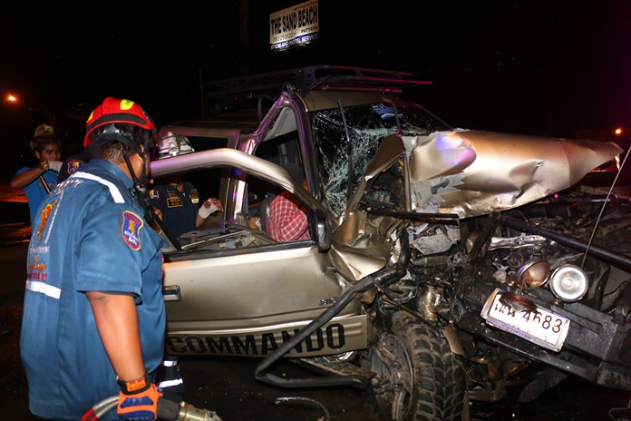 Rescue workers use the ‘jaws of life’ to remove the driver’s body.