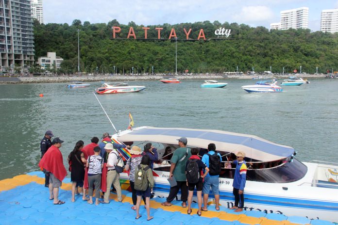 Tourists gather on the pontoon ready to board their speedboats for a day out on the islands.