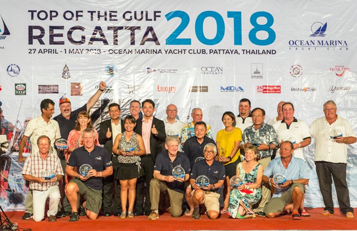 Winning sailors pose on the podium at the conclusion of the 2018 Top of the Gulf Regatta at Ocean Marina in Na Jontien, Pattaya, Tuesday, May 1.