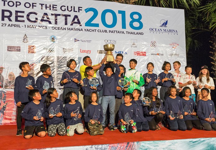Youngster Panwa Boonak raises the trophy after being crowned Thailand Optimist National Champion.