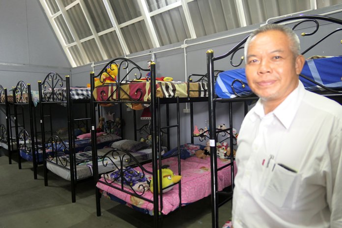 Palisorn Noja proudly shows off the sleeping quarters in the boys’ house.