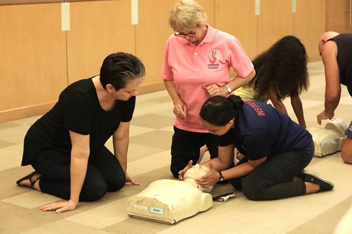Enthusiastic students record exactly how to administer CPR.