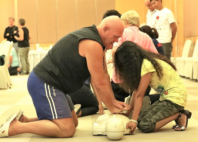 A PCEC member and his partner practice life saving skills.