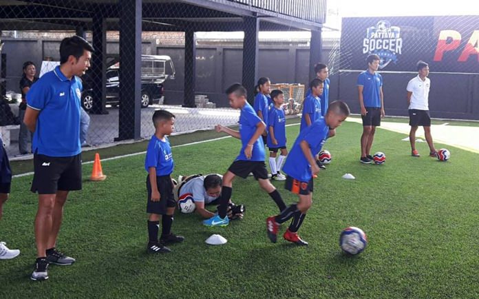 Kids were taught basic football techniques by coaches from Pattaya United.