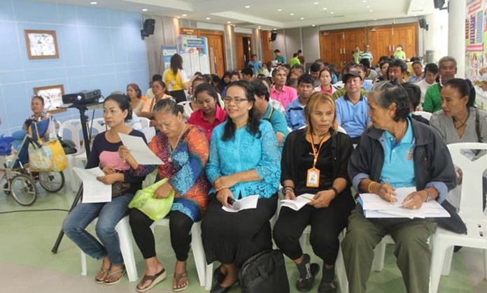Pattama Chiewchan (center) Director of Social Welfare Divison advises residents on how to apply for funds to support their businesses and occupational training.