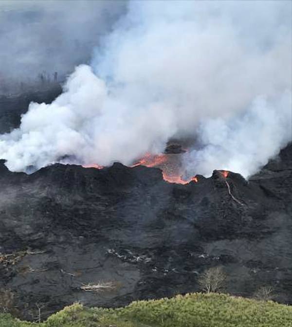 In this Saturday, May 26, 2018, image released by the U.S. Geological Survey HVO shows an aerial view of fissure 22 looking toward the south, as Kilauea Volcano continues its eruption cycle near Pahoa on the island of Kilauea, Hawaii. (U.S. Geological Survey via AP)