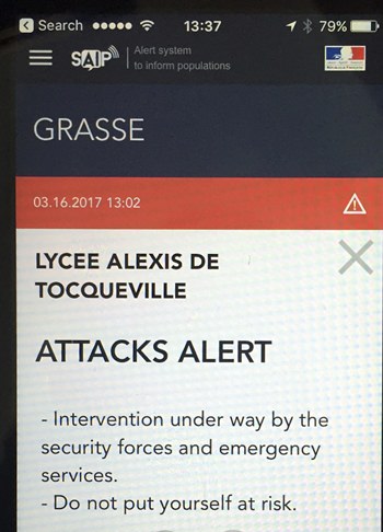 In this Thursday, March 16, 2017 file photo, a French police message alert of an attack at the Alexis de Tocqueville high school in the southern French town of Grasse is displayed on a cell phone in Paris. France’s Interior Ministry has announced plans to beef up its danger alert system to the public across social media. (AP Photo, File)